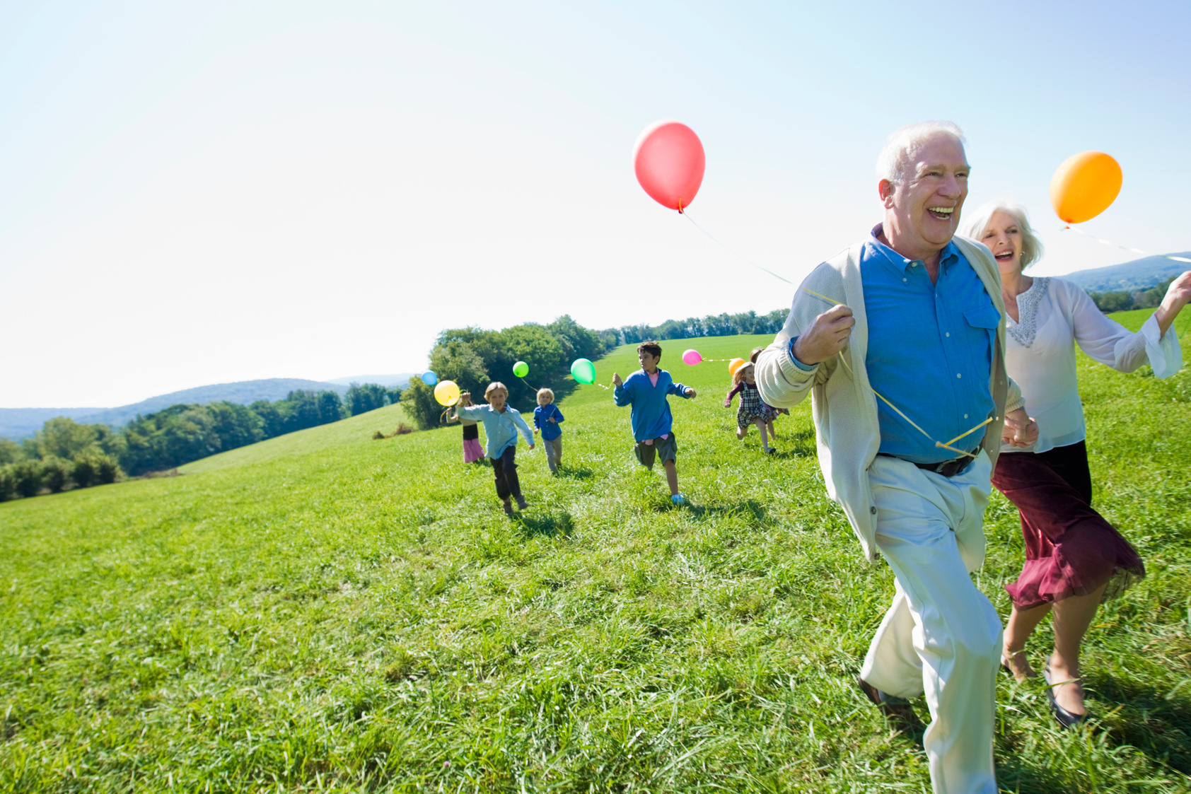 Grandparents running with grandchildren